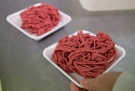 Fresh ground beef is packed at a butcher shop in Levis Que. (THE CANADIAN PRESS/Jacques Boissinot)