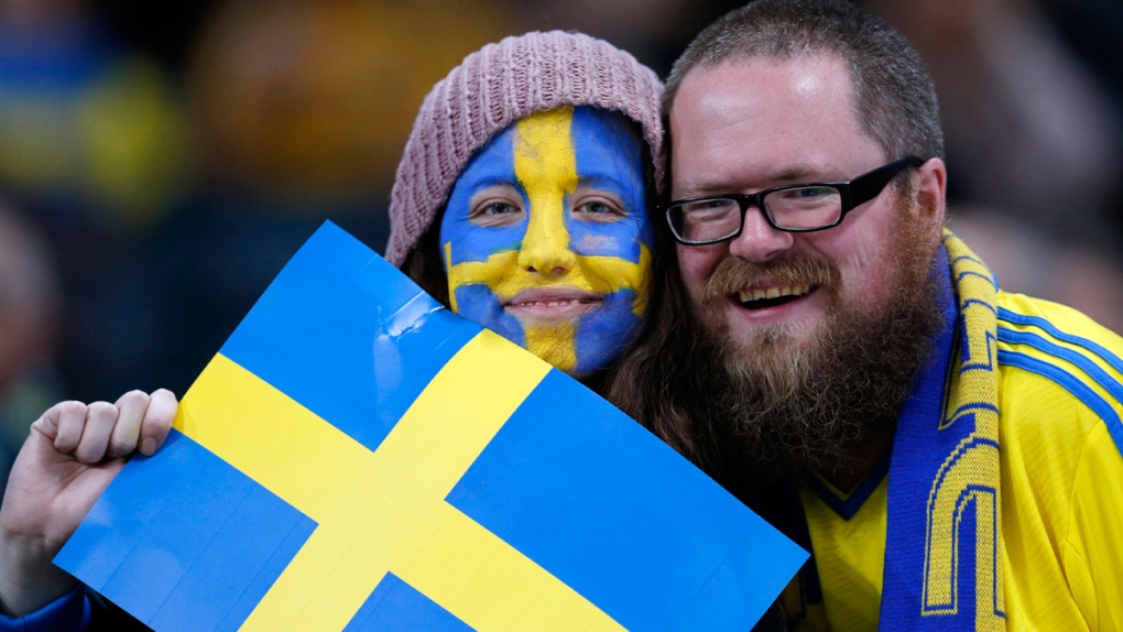 Posing with a Swedish flag