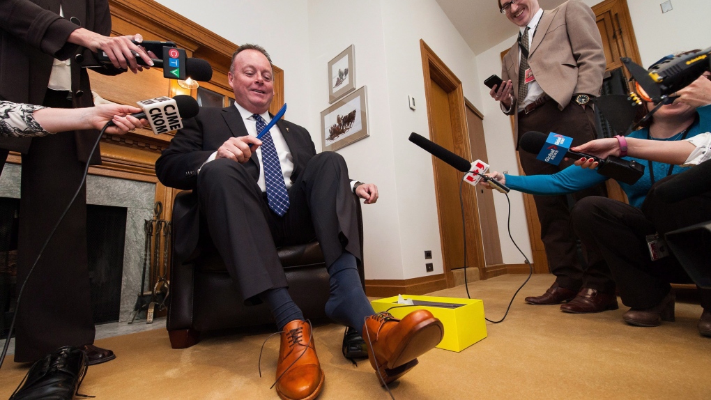Saskatchewan finance minister wearing tight shoes for tight budget