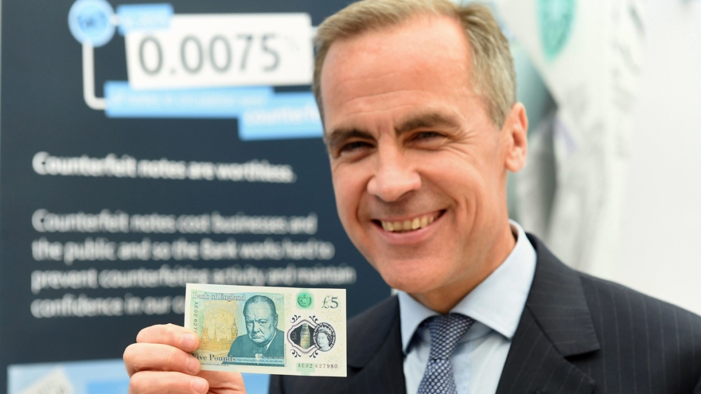 Mark Carney with the new polymer £5 note