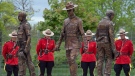 A bronze monument featuring life-size statues of Constables Doug Larche, Dave Ross and Fabrice Gevaudan, who were gunned down two years ago, is unveiled in Moncton, N.B., on Saturday, June 4, 2016. THE CANADIAN PRESS/Andrew Vaughan