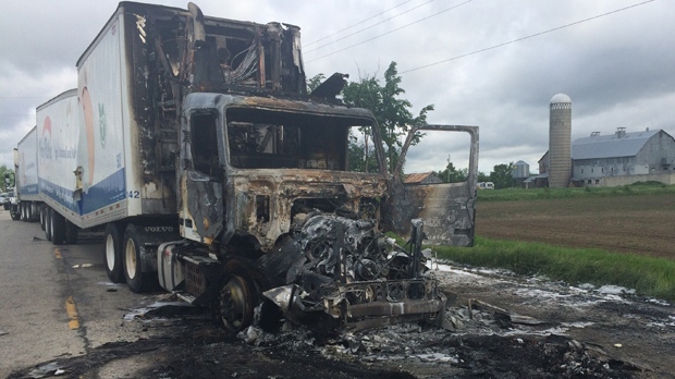 Transport truck destroyed by fire after a crash early Monday