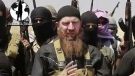 Omar al-Shishani – who was killed earlier this year – is seen standing next to the group's spokesman among a group of fighters is seen in this image made from undated video posted on a social media account frequently used for communications by the Islamic State of Iraq and the Levant posted during the weekend of June 28. (AP / militant social media account)