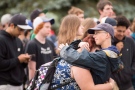 A woman is comforted in Woodstock after hundreds of high school students in the town walked out of classes, Tuesday, June 7, 2016 to raise awareness of a series of youth suicides. (THE CANADIAN PRESS / Geoff Robins)