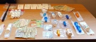 Some of the drugs and other items seized as part of a drug trafficking investigation are displayed. (Woodstock Police)