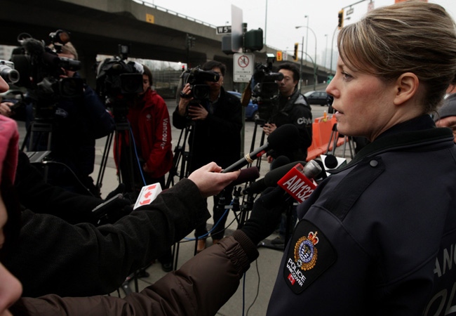 Vancouver Police Cnst. Jana McGuinness takes questions from the media after three off-duty police officers were arrested on allegations they assaulted and robbed a man in Vancouver, B.C., on Wednesday January 21, 2009. (THE CANADIAN PRESS/Darryl Dyck)