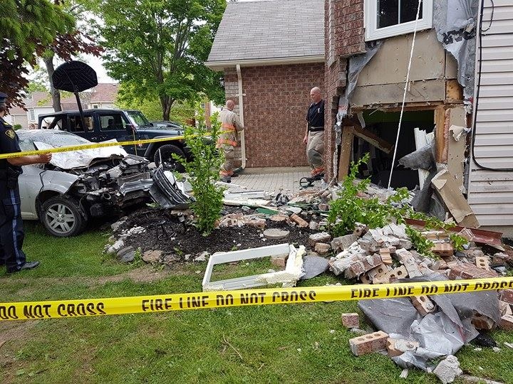 Debris can be seen on the lawn of a home in Dyer Drive in Wasaga Beach, Ont. on Sunday, June 12, 2016 after a car crashed into the building. (Stephanie Howard Thompson/ Facebook)