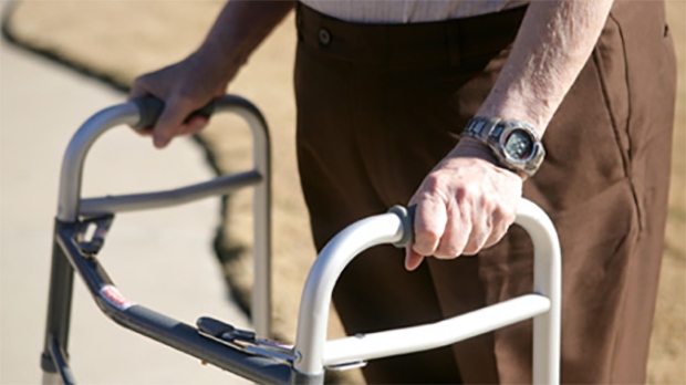 A senior citizen uses a walker in this file photo. 