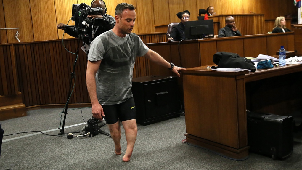 Oscar Pistorius walks on his stumps in court