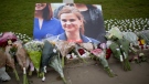 An image and floral tributes for Jo Cox on Parliament Square outside the House of Parliament in London, on June 17, 2016. (Matt Dunham / AP)
