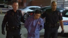Jin Qing Huang, 42, is charged with first-degree murder in the stabbing death of Tiejun Huang.