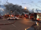 Firefighters battle a three-alarm blaze at an electronics store in the city’s Golden Mile neighbourhood Monday June 27, 2017. (@ItsJonOrlando /Twitter)