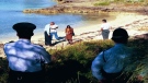 Members of the jury look at the beach known as Whale Bone Bay in Hamilton, Bermuda in November 1998 where the rape and murder of Rebecca Middleton took place in June 1996. (AP Photo/David Skinner)