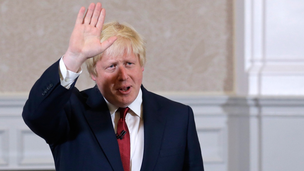 Boris Johnson waves in London
