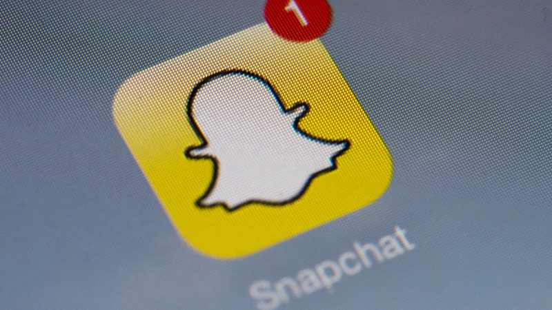 Snapchat icon on a smartphone. (AFP PHOTO / LIONEL BONAVENTURE)