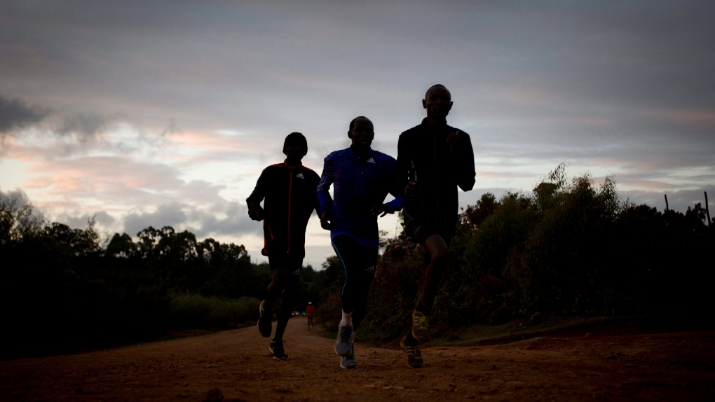 Kenyan athletes train just after dawn
