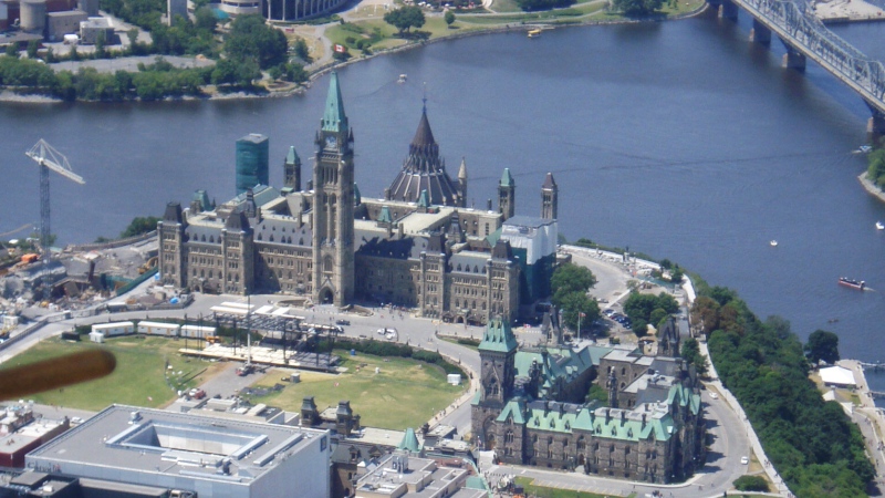 This aerial view shows Parliament Hill with the backdrop of the Ottawa River on July 5, 2016.