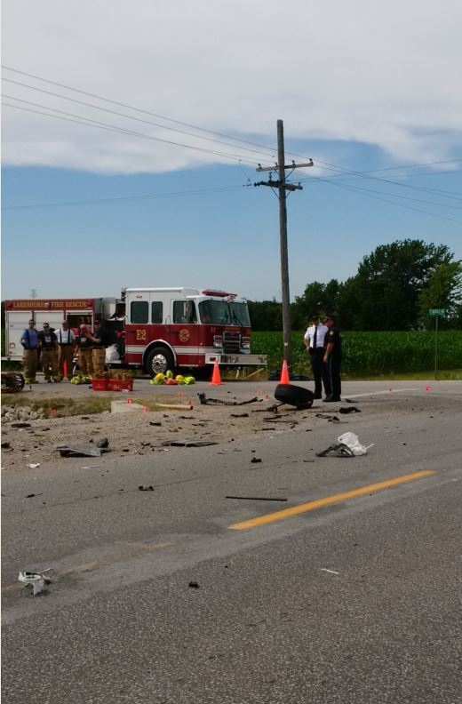 Debris is left on the road after a crash at Naylor and South Middle side roads in Lakeshore, Ont., on Monday, July 18, 2016. (Courtesy OPP)