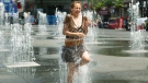 A woman is splashed at Yonge-Dundas Square in this undated file photo.