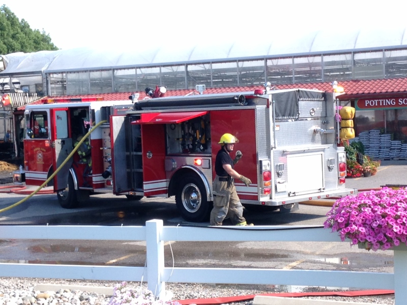Firefighters battle a blaze at Family Flowers near St. Thomas, Ont. on Friday, July 22, 2016.
(Jim Knight / CTV London)
