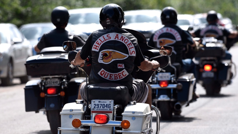 Members of the Hells Angels ride outside the Hells Angels Nomads compound during the group's Canada Run event in Carlsbad Springs, Ont., near Ottawa, on Saturday, July 23, 2016. (THE CANADIAN PRESS / Justin Tang)