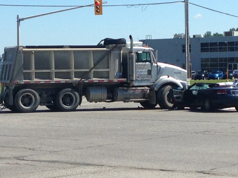 A dump truck and car crash on Tuesday, July 26, 2016, in London, Ont. have left one person with serious injuries.
(Gerry Dewan / CTV London)