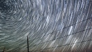 Perseid meteors, upper left, streak past time-lapse-captured stars early Tuesday morning, Aug. 13, 2013 north of Cheyenne , Wyo. The Perseids meteor shower runs from mid-July through mid-August. (AP Photo / The Wyoming Tribune Eagle, Blaine McCartney, File)