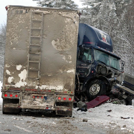 A tractor trailer is tangled after colliding with a car on Highway 17, Thursday, Jan. 29, 2009. Credit: Gerald Tracey/ The Eganville Leader