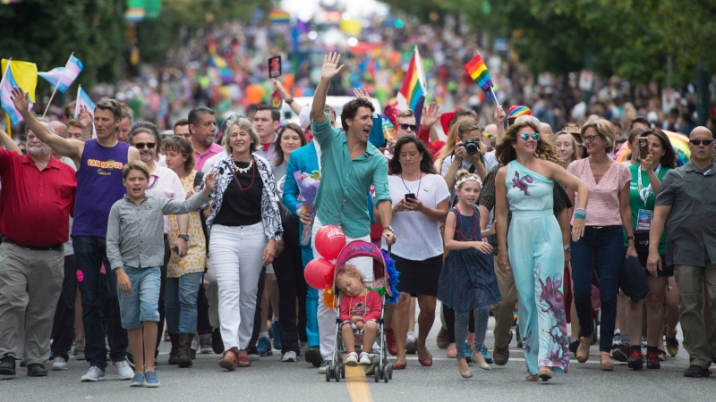 Prime Minister Justin Trudeau along with his wife Sophie Gregoire Trudeau and kids Hadrien, Ella Grace and Xavier take part in the Pride Parade in downtown Vancouver, B.C., Sunday, July, 31, 2016. (Jonathan Hayward/The Canadian Press)