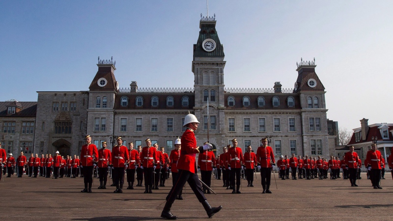 Members of the graduation class of Royal Military College of Canada stand in the square at RMC during graduating ceremony in Kingston, Ont., on Friday, May 20, 2016. (THE CANADIAN PRESS/Lars Hagberg)