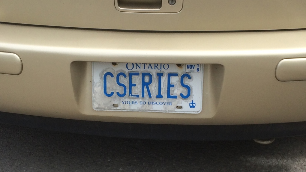 A car with a CSERIES licence plate is parked in Mo