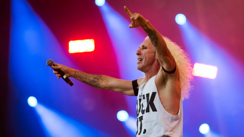 Dee Snider takes takes part in the show of the Brazilian metal band Angra at the Rock in Rio music festival in Rio de Janeiro, Brazil, Saturday, Sept. 19, 2015. (AP Photo/Felipe Dana)