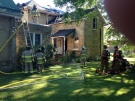 No injuries in large fire at Parkhill century home, on Thursday, August 9, 2016 and a church next door was not damaged. (Sean Irvine / CTV London)