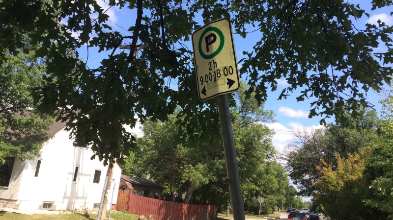 At a quick glance, the sign seems to indicate that parking is permitted on either side of the pole for two hours, that's what Barrett thought when she first parked there.