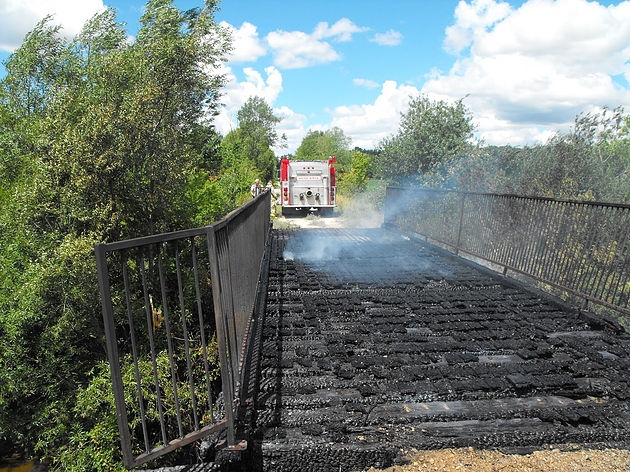 Minto Township walking bridge set aflame