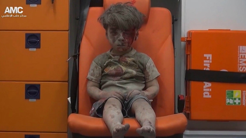 Syrian child pulled to safety after airstrike