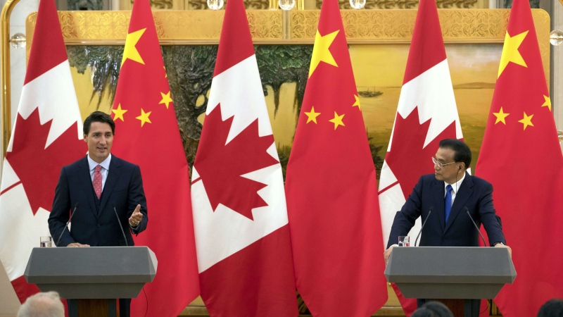 Prime Minister Justin Trudeau, left, speaks during a joint press conference with China's Premier Li Keqiang, right, at the Great Hall of the People in Beijing, Wednesday, Aug. 31, 2016. (AP / Mark Schiefelbein)