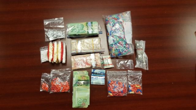 London police display drugs and cash seized on Wavell Street. (Courtesy London police) 