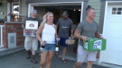 Chris and Caitlin Neil collect bottles in a Kanata neighbourhood, Sep. 6, 2016