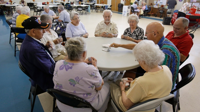 A group of retired senior citizens gather for cards at the Citrus County Resource Center in Lecanto, Fla., on Wednesday, Sept. 10, 2014. (AP Photo/John Raoux)