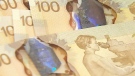 Canadian $100 dollars bills are seen in this file photo.