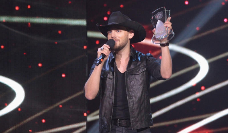 Brett Kissel accepts his award for Male Artist of the Year at the Canadian Country Music Association Awards in London, Ont., on Sunday, Sept. 11, 2016. (THE CANADIAN PRESS/Dave Chidley)