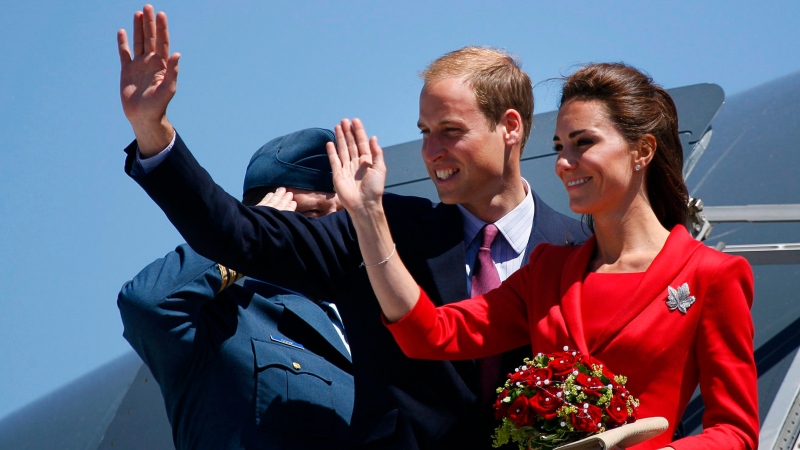 The Duke and Duchess of Cambridge wave from their plane before departing from their cross-Canada tour in Calgary, Alta., Friday, July 8, 2011. (Jeff McIntosh/THE CANADIAN PRESS)