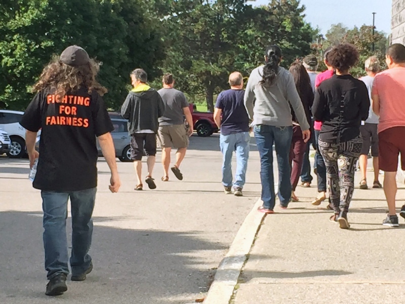 Employees of Hematite Manufacturing leave a meeting after learning that they will be returning to work. (Victoria Levy / CTV Kitchener)