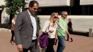 Former Ottawa Senators defenceman Chris Phillips leaves court with his wife Erin Phillips on Sept. 21, 2016.