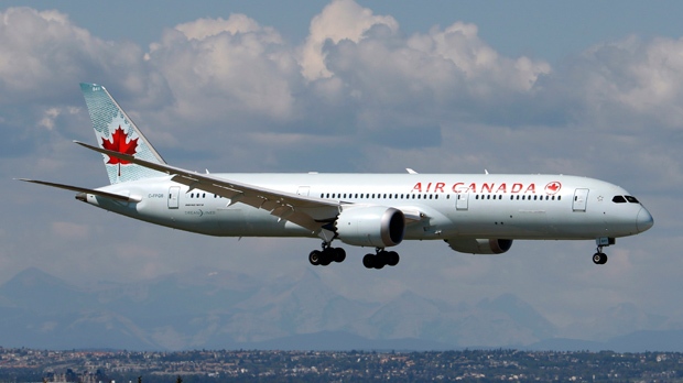 A Boeing 787 (787-9) Dreamliner jet, belonging to Air Canada, lands in Calgary, Alberta on Aug. 4, 2016. The Rocky Mountains are in the distance. THE CANADIAN PRESS IMAGES/Larry MacDougal