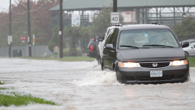 Vehicles struggled to get through flooded streets in Windsor and Tecumseh, Ont., on Thursday, Sept. 29, 2016. (Melanie Borrelli / CTV Windsor)