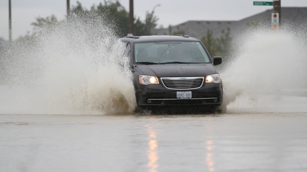 Vehicles struggled to get through flooded streets in Windsor and Tecumseh, Ont., on Thursday, Sept. 29, 2016. (Melanie Borrelli/CTV Windsor)