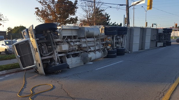 A truck carrying pigs headed to a slaughterhouse is seen overturned on a Burlington road. (Dave Ritchie/ CP24)