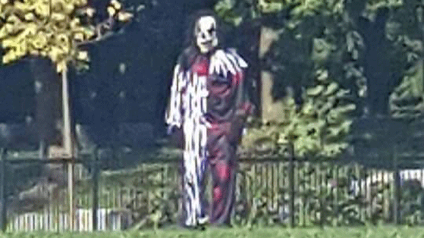 A suspect dressed in a clown costume at Pope Francis Catholic School is seen in a still image taken from a video.